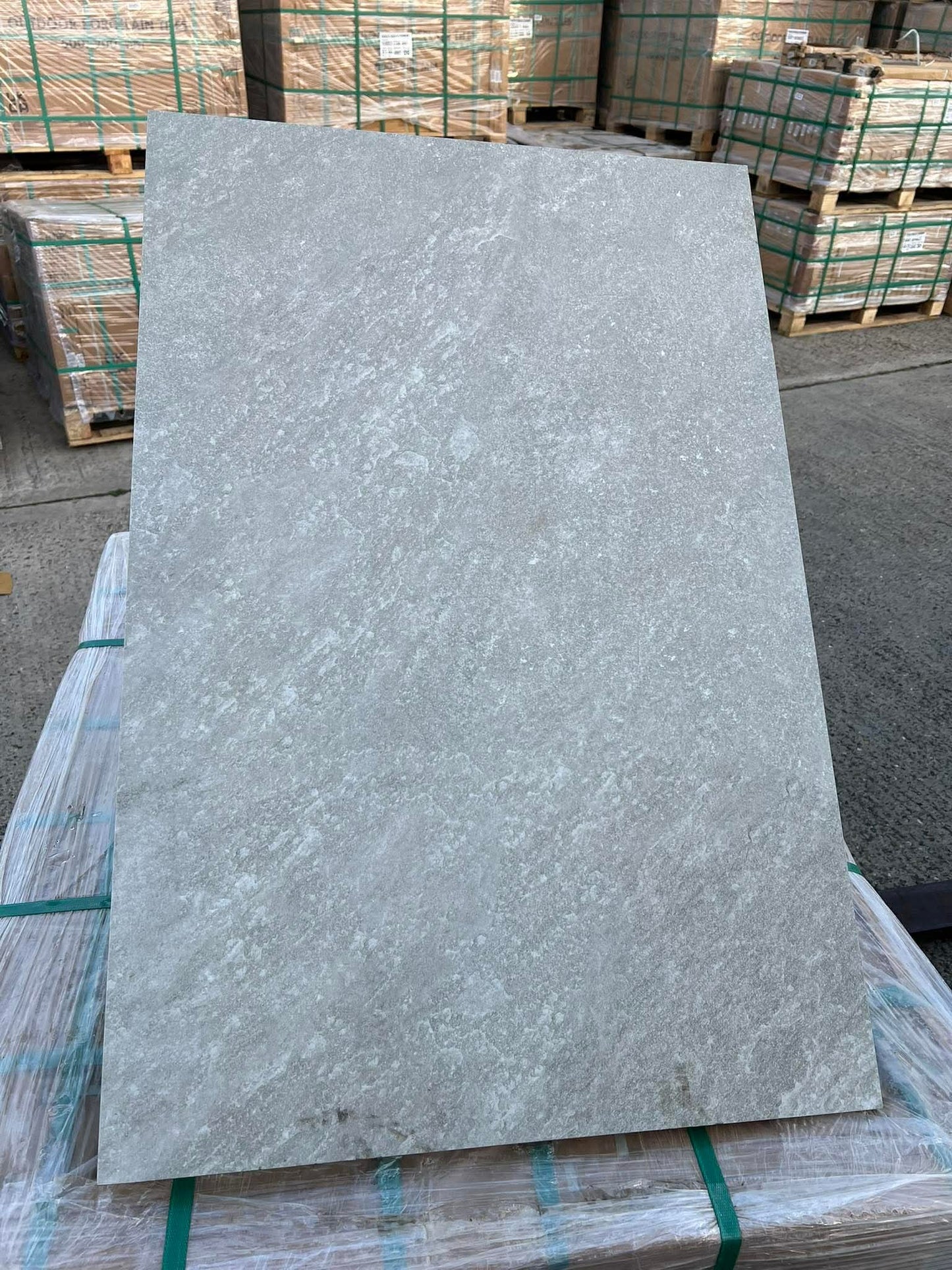 Quartz Grey porcelain paving slabs installed on modern outdoor patio
