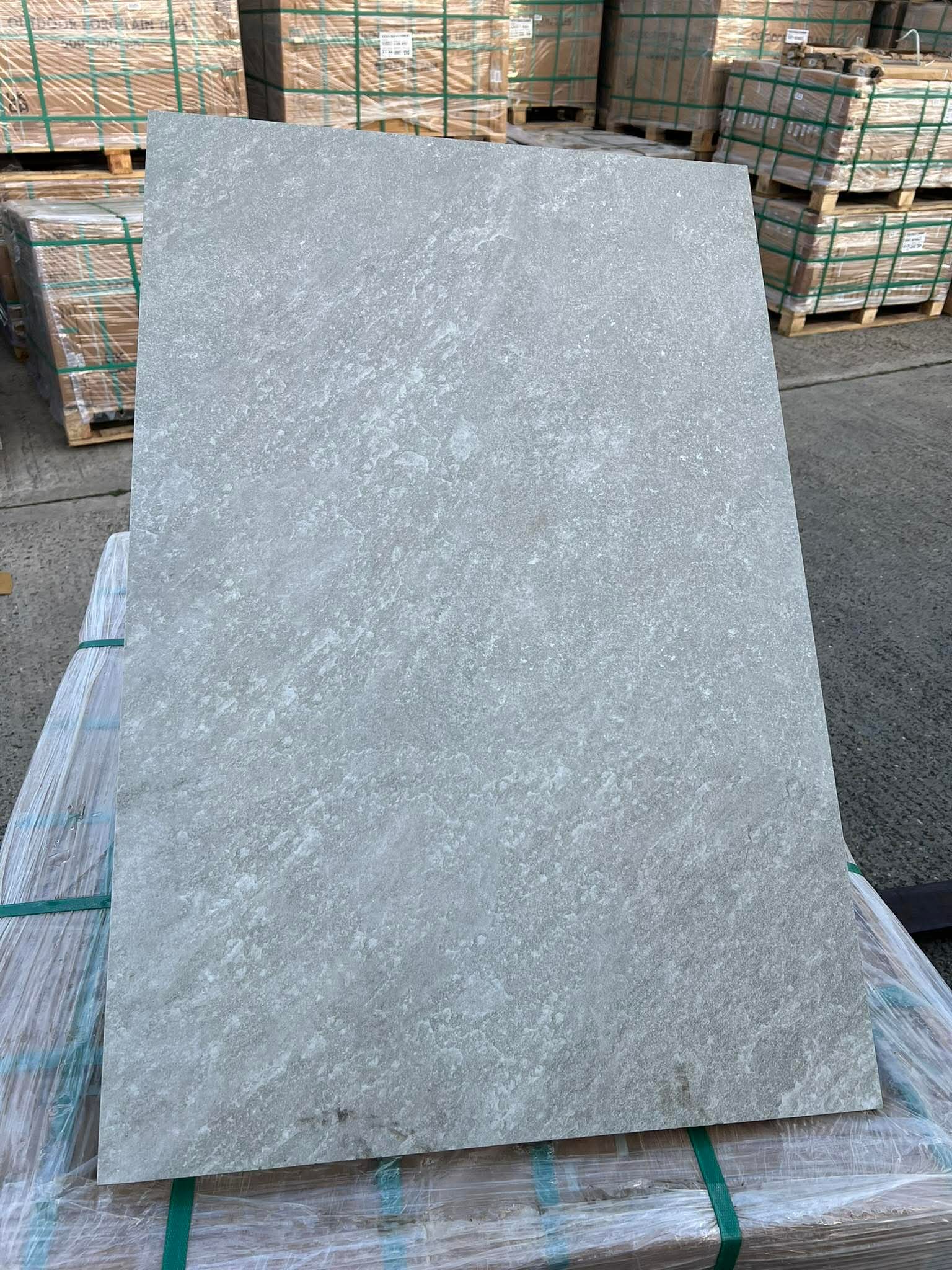 Quartz Grey porcelain paving slabs installed on modern outdoor patio
