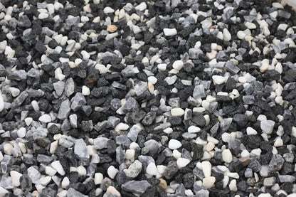 Close-up of 20mm Black Ice chippings showing dark grey and black angular stone gravel