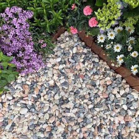 Close up of Flamenco gravel 20mm showing pink grey and white stones